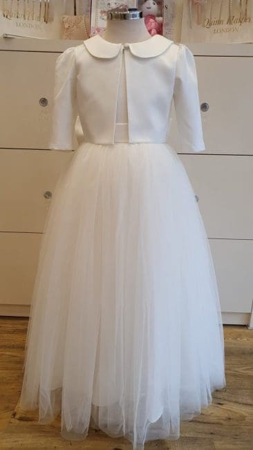 Ivory Girls Occasion wear Flower Girl Dresses and Girls Holy Communion Dresses at Quinn Harper Childrens Occasion Wear at 331 Kings Road Chelsea London SW3 5ES UK rotated 1 scaled
